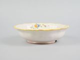 a close up of a bowl on a table with a gray background