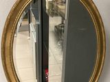 a mirror hanging on a wall in a room