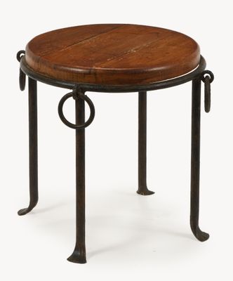 a round wooden table with metal legs and a wooden top