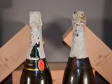 two bottles of champagne that are sitting on a table