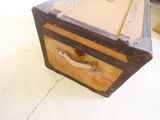 an old suitcase sitting on the floor in a room