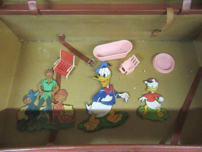 a toy set of donald duck, donald duck, donald duck, donald duck and donald duck in a suitcase