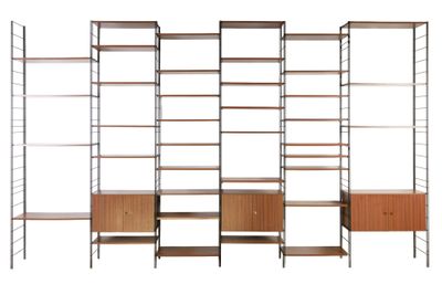 an image of a set of shelvings with shelves and drawers