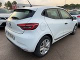 the rear end of a white car parked in a parking lot