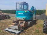 a blue and yellow excavator and a yellow and black bulldozer in a field