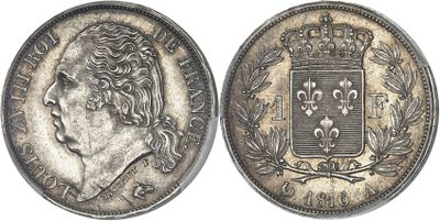 a silver coin with a crown on top of it