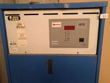 a blue and white machine that is sitting in a room