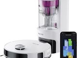une machine blanche et noire, avec un téléphone portable à côté