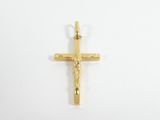 un pendentif en forme de croix en or sur lequel est représenté Jésus