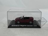 a small red car in a clear display case on a white surface