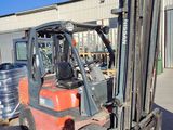 a fork lift truck parked in front of a building