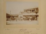 an old photo of a group of people standing in front of a building