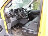 a yellow truck with a steering wheel and a dashboard