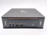 a small black laptop with a red stripe on it