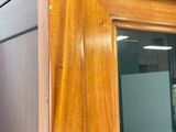 an image of a wooden cabinet with a glass door