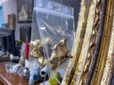a mirror that has a bunch of gold bells in it