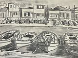 many boats in the water near a row of buildings