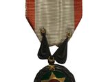 l'image d'une médaille surmontée d'une étoile