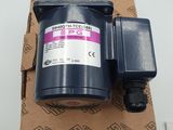 a close up of a water pump on top of a cardboard box