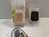 two electronic devices that are sitting on a table