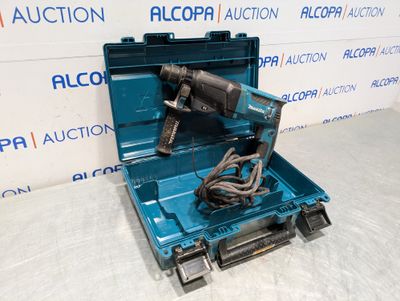 a close up of a blue tool box with a drill in it