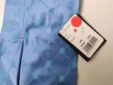 the tie is blue and has a red dot on it