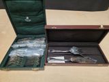 a lot of silverware in a case on a table