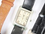 three different types of watches sitting next to each other