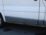 a white van parked on the side of the road