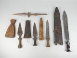 a lot of different types of knives on the table