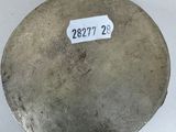 a metal object with a sticker on it