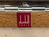 a close up of a wooden box with a red label on it