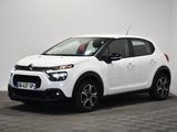 a white citrole is parked in a room with a checkered floor
