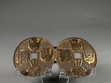 two chinese gold coins on clear acryl bases