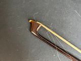 a wooden bow that is laying on top of a table