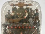 a glass bottle with a miniature scene inside of it