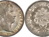 une pièce d'argent portant une tête de femme et des lauriers