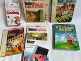 plusieurs livres pour enfants sont alignés sur une surface blanche