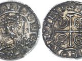 a silver coin with a cross on the front and a cross on the back