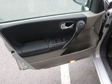 a car door open with the driver ' s side door open