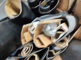 many pairs of shoes that are sitting on the floor
