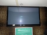 a flat screen tv mounted on the wall in a room