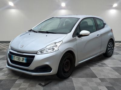the small silver car is parked in a room with a checkered floor