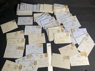 a pile of old letters and envelopes on a table