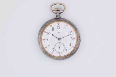 a silver pocket watch with a white face on a white surface