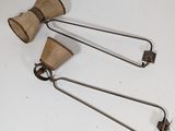 pair of metal and wood utensils on a white surface
