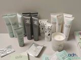 many different types of skin care products displayed on a table