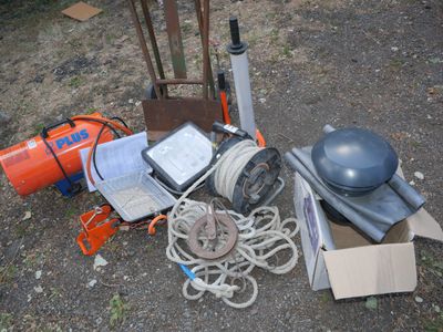 a pile of junk on the ground next to a fire hydrant