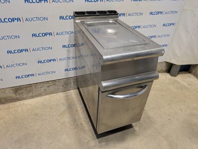 a stainless steel sink and a stove in a room