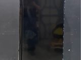 an image of a black refrigerator with a door open